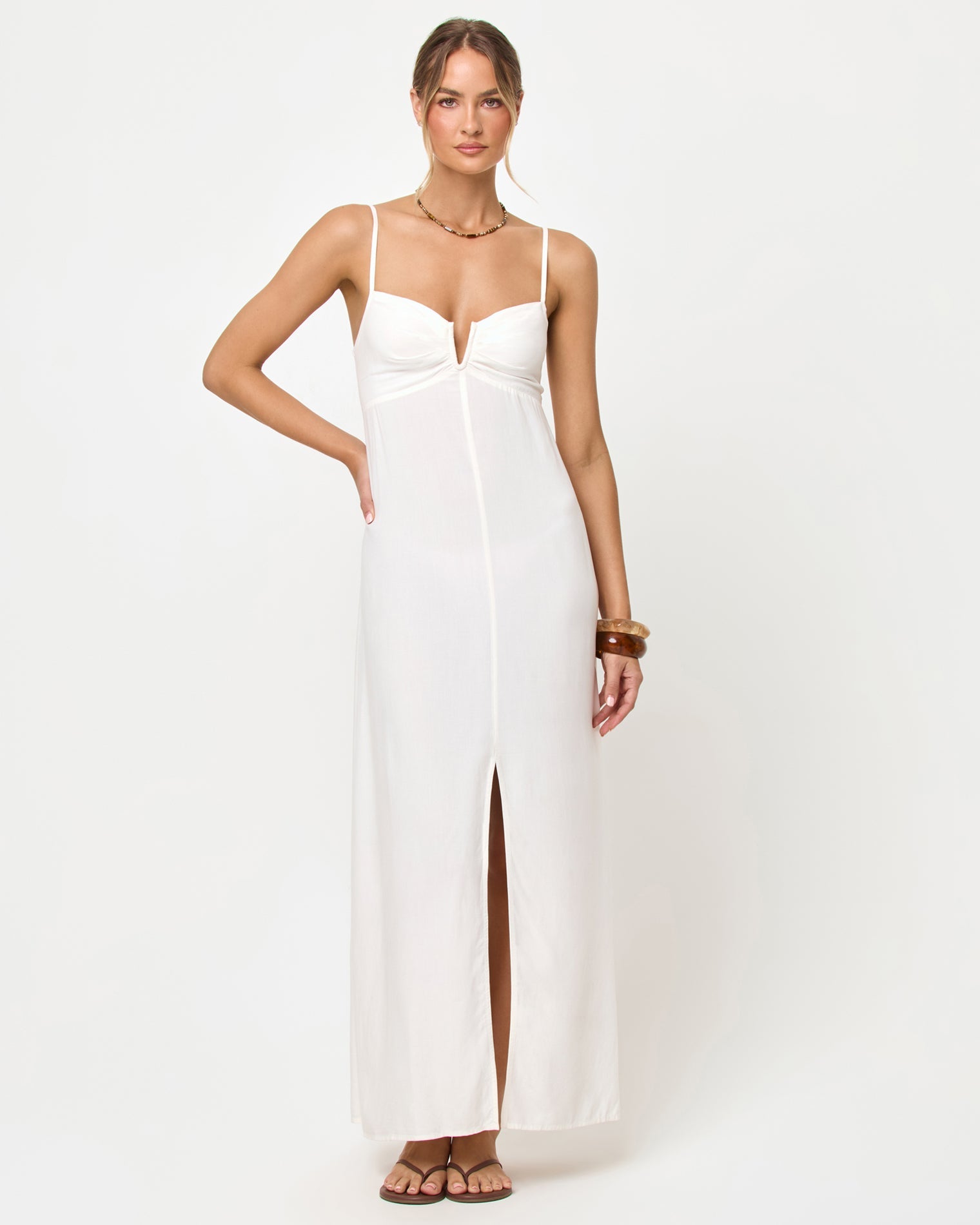 Cream | Badge:New Arrival_#B2AC88_#ffffff'
Woman wearing a white maxi dress with a side slit on a white background
