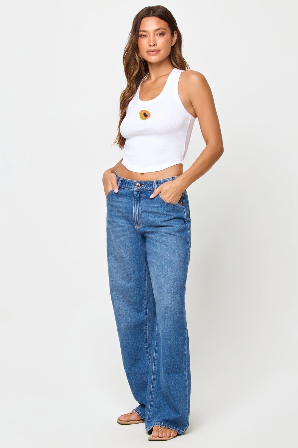front view of white ribbed tank top with beaded papaya design