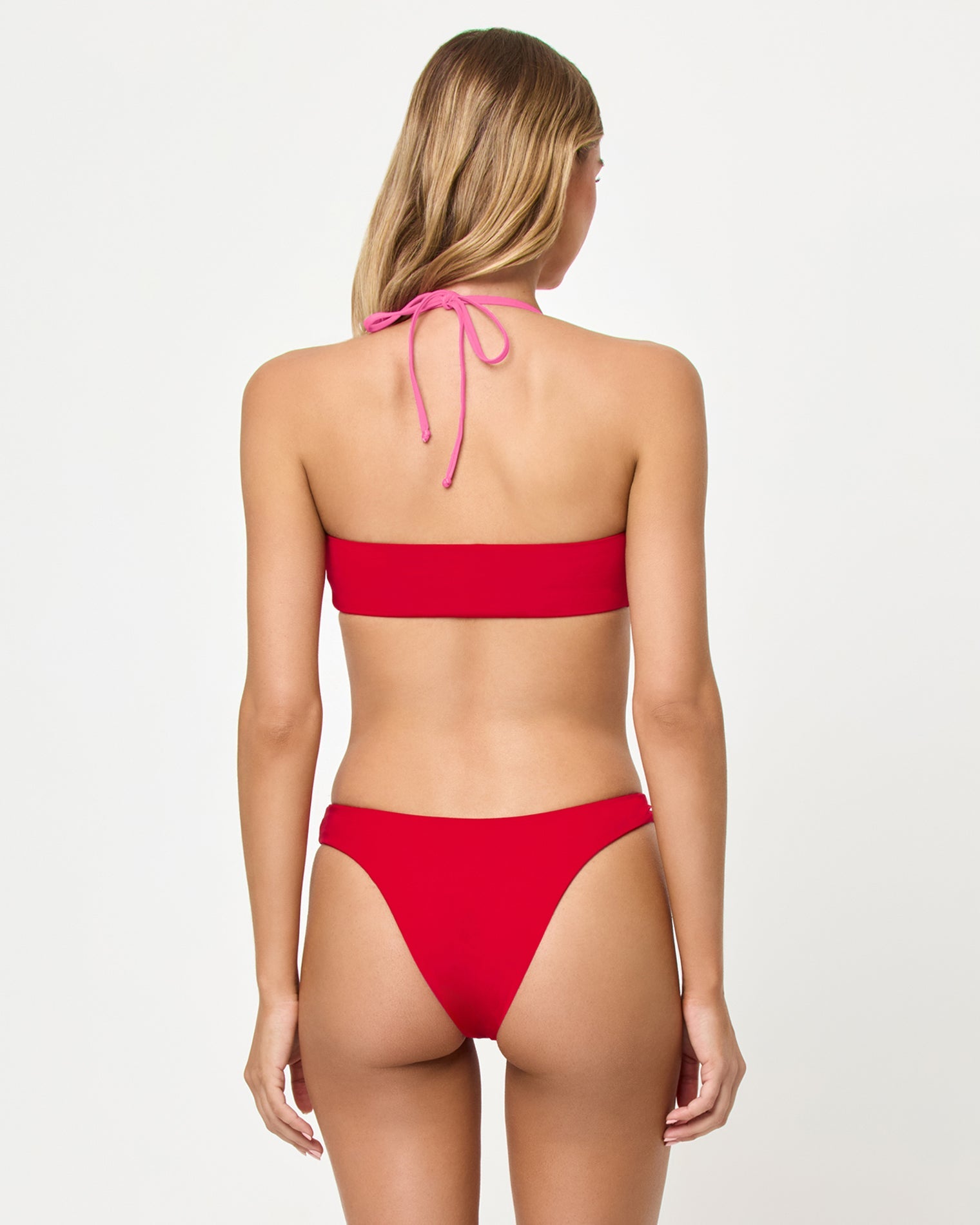 back-view of pink and red bralette bikini top and bottom