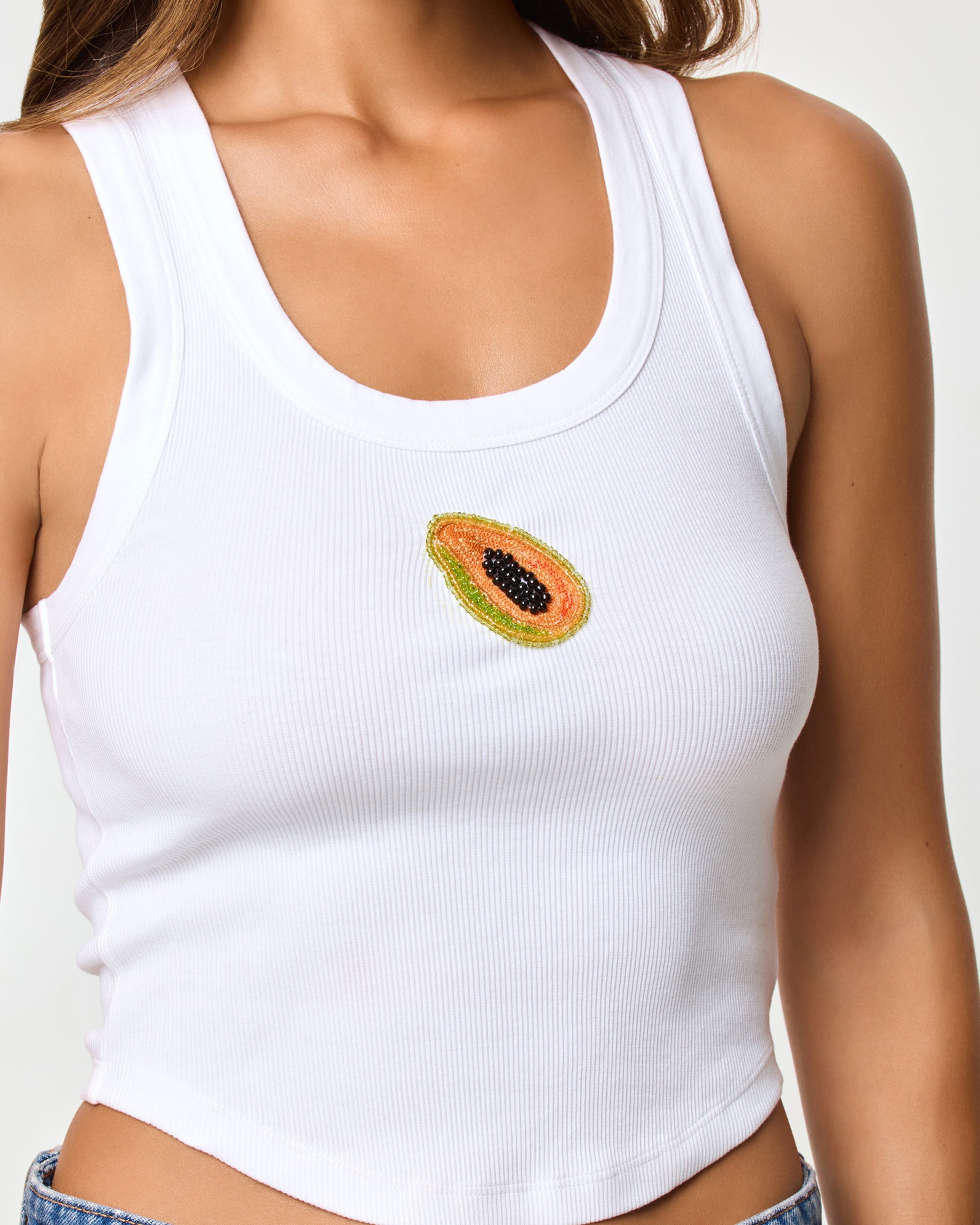 white ribbed tank top with beaded papaya design